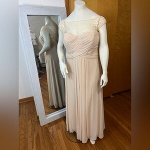 Elegant Cream Mori Lee size 28 dress with sheer mesh neck line.